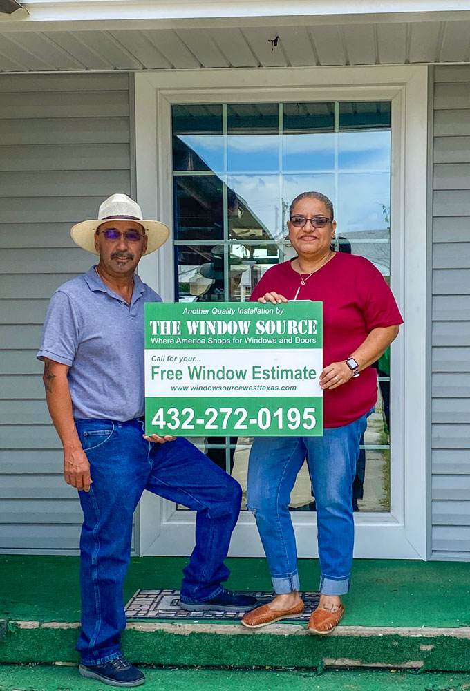Happy home owners with their new double hung windows.